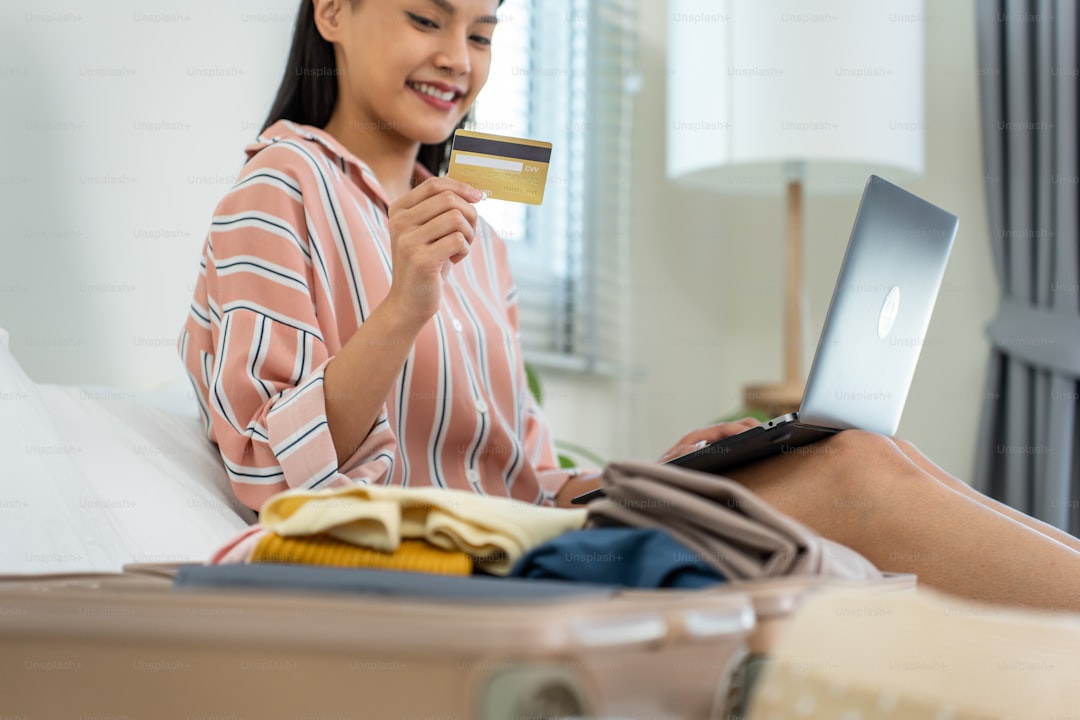 Chase credit cards arranged next to a laptop showing travel bookings